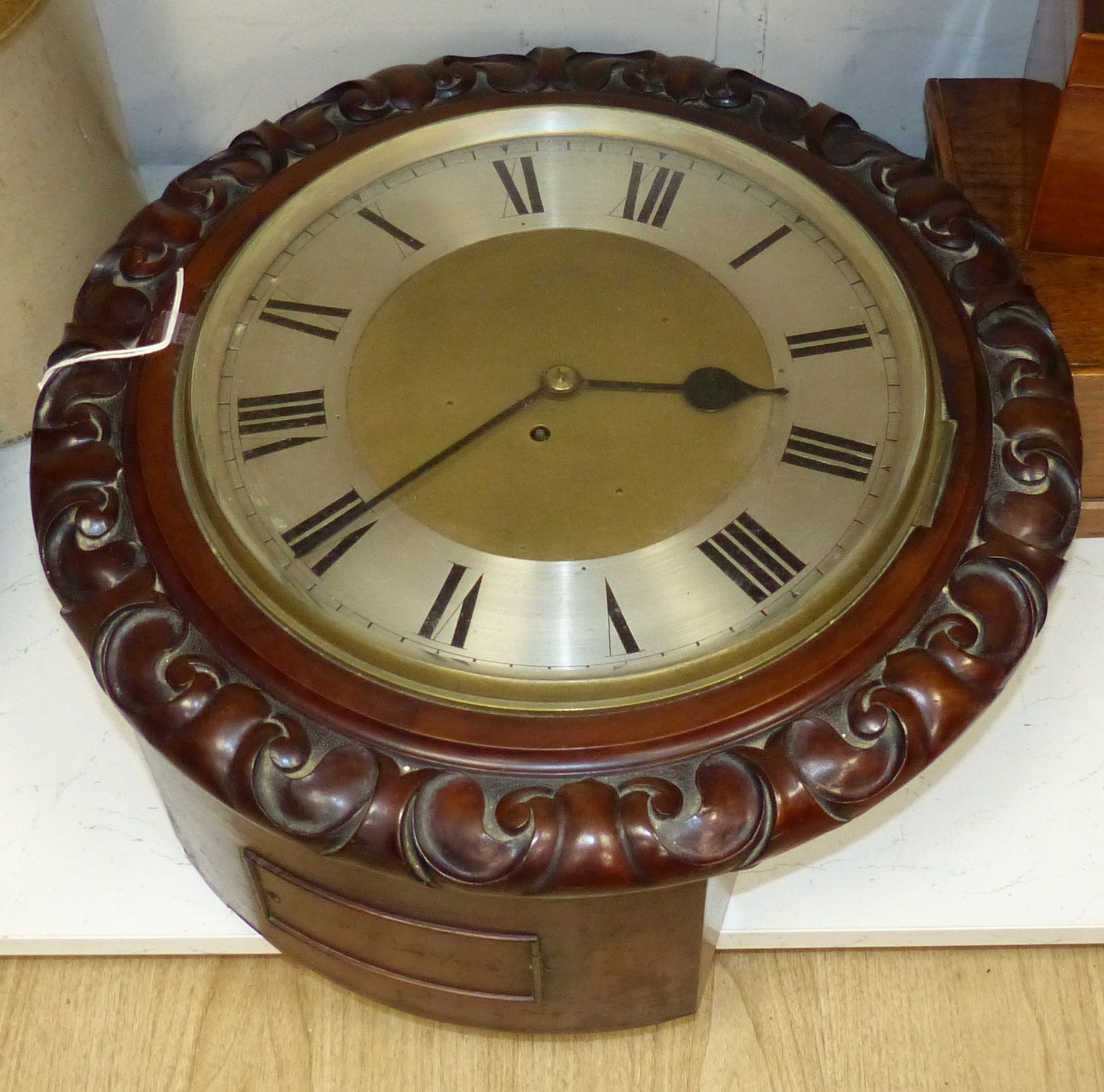 A good large Victorian carved mahogany dial clock with key and pendulum, diameter 51cm